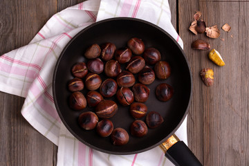 Roasted chestnuts in a pan