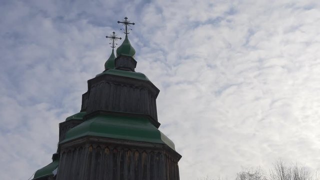 Tower of Wooden Church Green Roofs Crosses on Top Winter Church of Paraskeva the Holy Martyr in Pirogovo Ukrainian Sacral Architecture Baroque Style