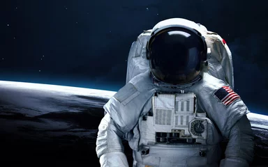 Schilderijen op glas Astronaut in de ruimte. Ruimtewandeling. Elementen van deze afbeelding geleverd door NASA © Vadimsadovski