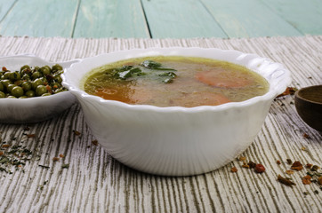 Soup with vegetables, green peas and spices.