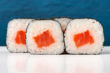 Set of simple japanese rolls with salmon, rice and nori