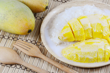 Sweet mango with sticky rice mix with coconut milk