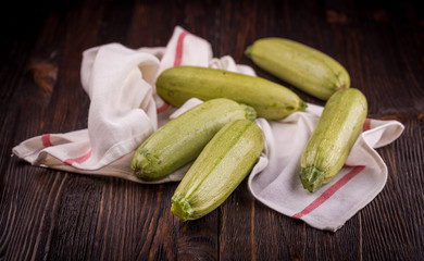 Fresh zucchini on wooden table
