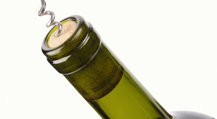 corkscrew with a bottle of wine isolated on a white background