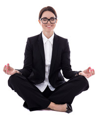 young beautiful business woman sitting in yoga pose isolated on