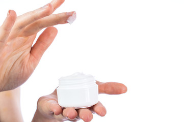 Beautiful woman hand with cream close-up, isolated on white