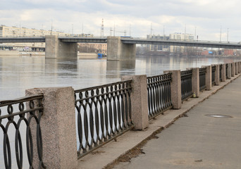 Volodarsky Bridge and fence on the embankment of the Neva River.