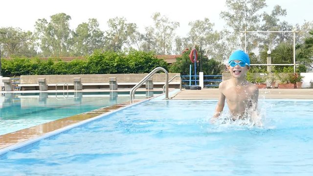 Young boy having fun in swimming pool