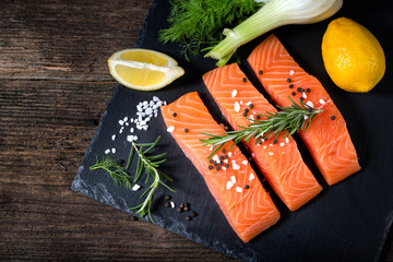 Salmon filet sliced on three parts  with lime.