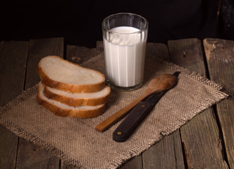 Poor rural breakfast: glass of milk and bread