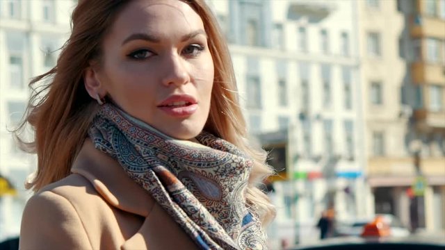 Beautiful young woman smiling. Walking in the city