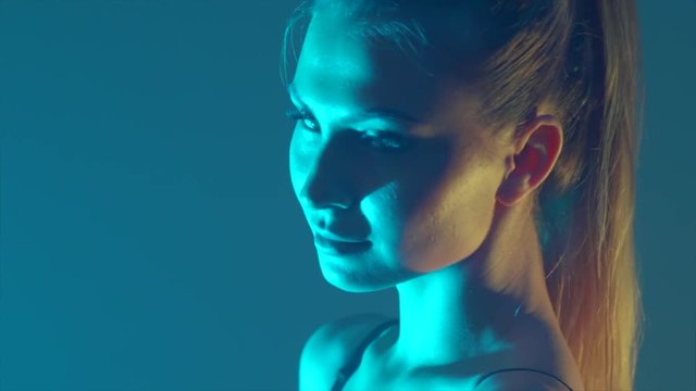 beautiful young woman standing on the background