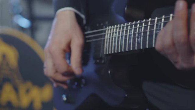 Guitarist on stage for background, soft and blur concept