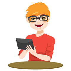 Young red hair nerd teenager boy with black tablet