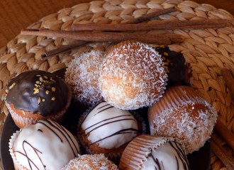 Homemade Vanilla Muffins With Chocolate And Grated Coconut.