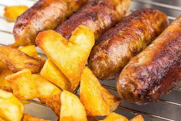 Grilled meat sausages with fried potatoes