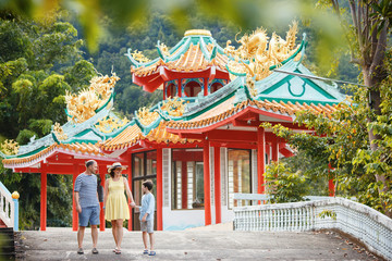 Fototapeta premium Family enjoying views of beautiful Chinese Temple on Koh Phangan island