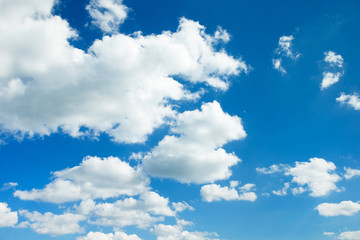 white fluffy clouds in the blue sky