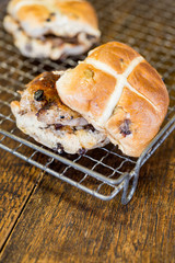 Two Sausage Cross Buns on Wire Cooling Rack