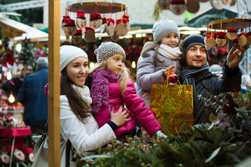 Fototapeta premium Family with children purchasing toys