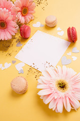 Mothers day card with flowers on yellow table