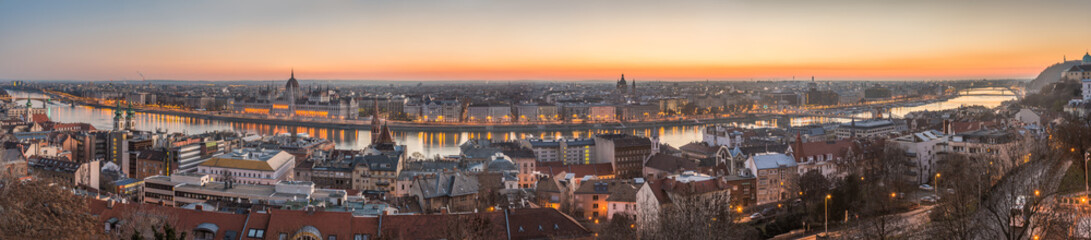 Wide Panorama of Budapest with Hungarian Parliament and Danube River at Dusk