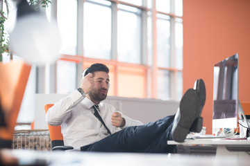 relaxed young business man at office