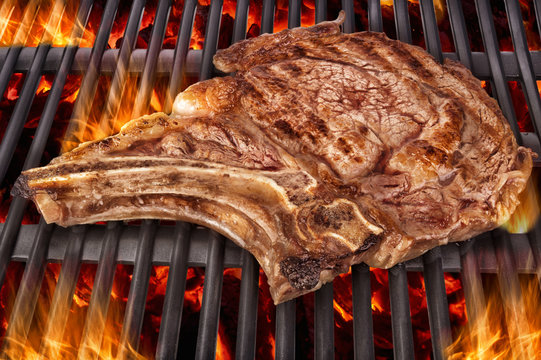 Cooking T Bone Steak On Barbecue