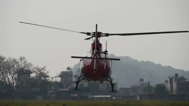 Take off of a small helicopter from the ground