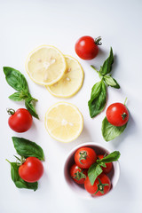 red ripe tomatoes and basil leaves