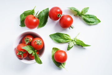 red ripe tomatoes and basil leaves