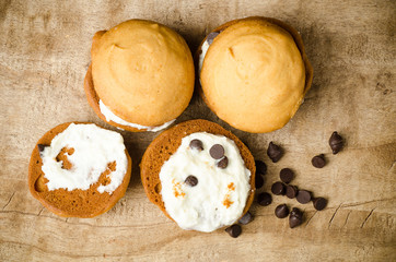 Homemade cookies with whipping cream and chocolate chip on top