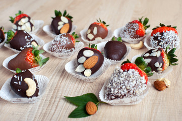 Strawberry covered with milk and dark chocolate and coconut flak