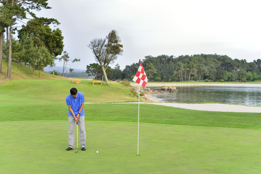 Man playing golf