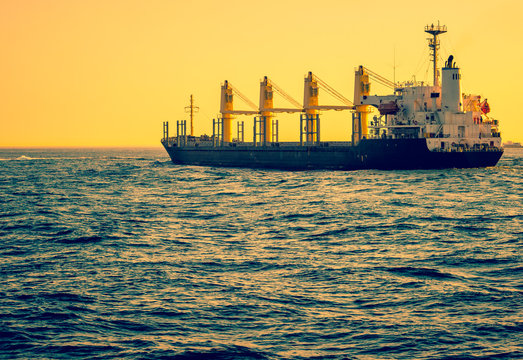 Freight transport - cargo ship sailing at sea.
