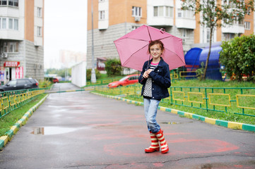 School aged kid  girl in rainy day