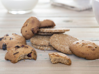 Close up of biscuits to breakfast. Good morning with cookies and milk on a wooden table.
