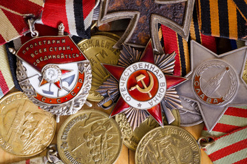 Fototapeta na wymiar Collection of vintage Soviet military medal and orders (the Patriotic War; the proletarians of all countries, unite; glory; Defense of Stalingrad, Defense of Moscow) 
