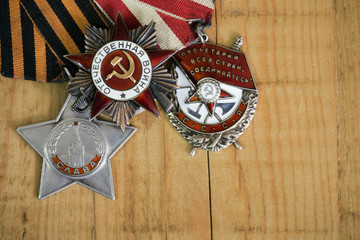 Collection of vintage Soviet military orders on wooden board (the Patriotic War; the proletarians...