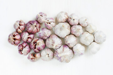 Garlic on the white wooden table