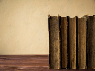 Pile of old antique books on the table