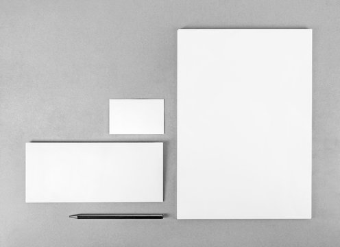 Photo of blank stationery set. Blank stationery template for branding identity for designers. Top view. Grayscale image.