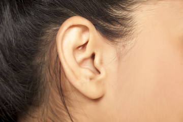 close up of female ear - obrazy, fototapety, plakaty