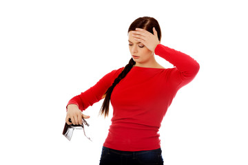 Young student woman holding empty wallet
