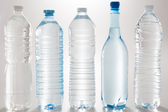 Different water bottles isolated on a white