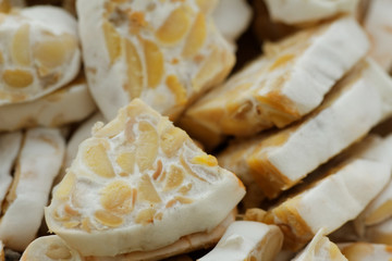 Sliced fresh raw tempeh. Close up showing texture of tempeh. Tempeh is made from soya bean and popular in some part of Asia.