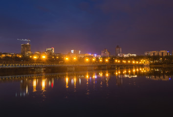 Fototapeta na wymiar Night city reflection on the river in Donetsk. Ukraine