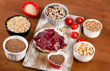 Foods highest in Copper on wooden board.