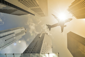 Airplane flight over modern building