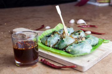 Allium tuberosum. Garlic chives with soy source on babana leaf